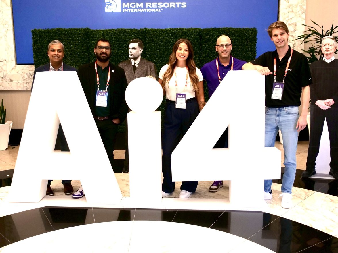 Matt Gosselin with colleagues at the Ai4 conference